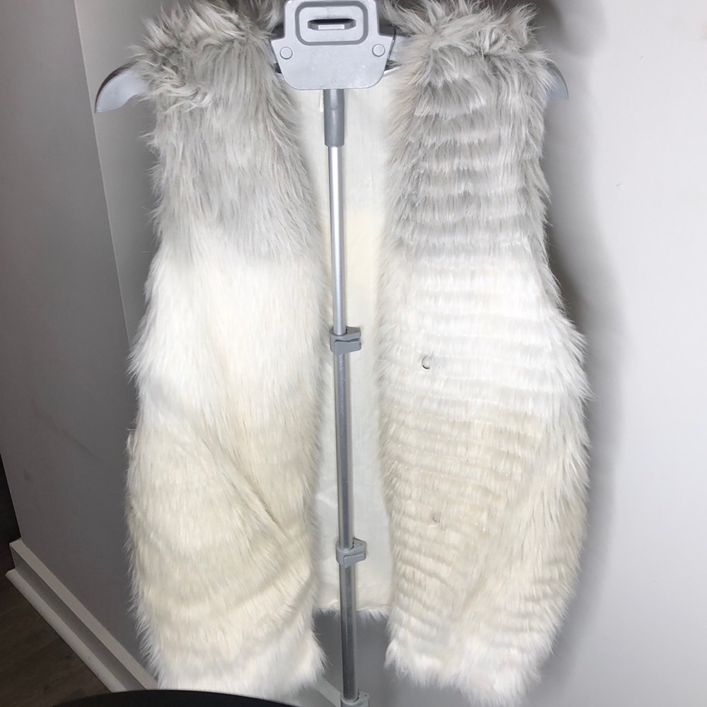 White fur vest